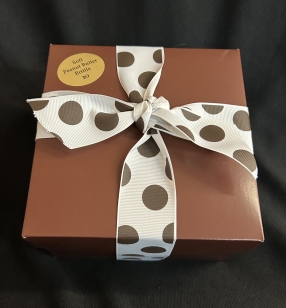 2# Soft Peanut Butter Brittle in a pink and brown box and tied with brown satin ribbon